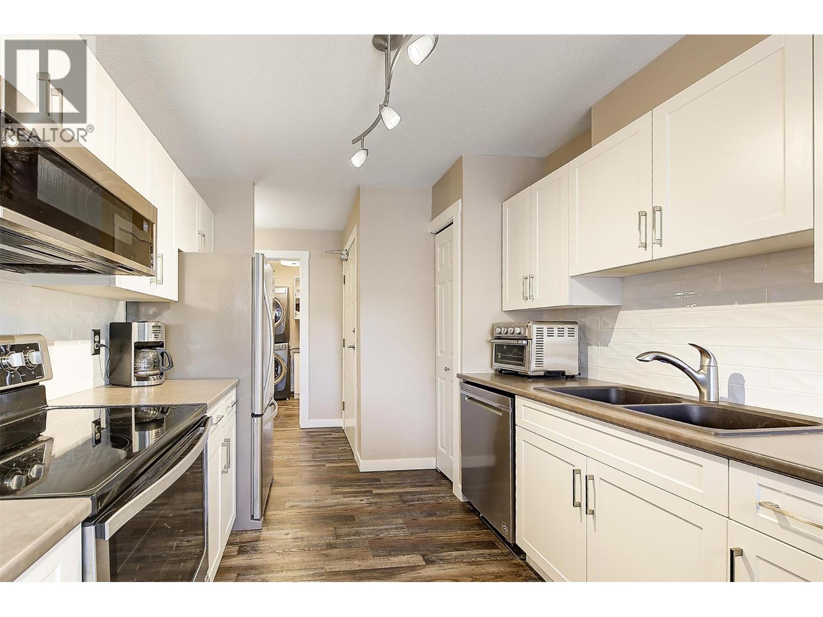 3842 Gordon Drive Unit# 216, Kelowna, British Columbia  V1W 3G4 - Photo 1 - 10399575