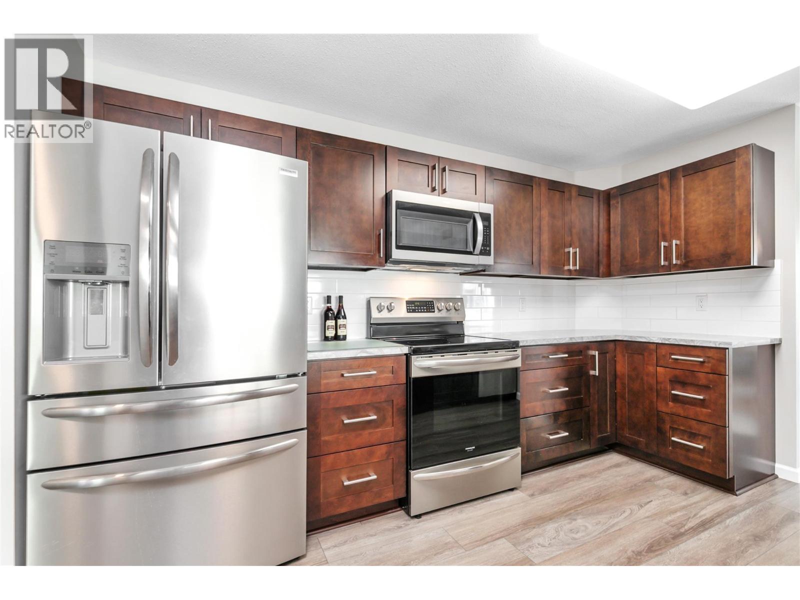 1329 Klo Road Unit# 404, Kelowna, British Columbia  V1W 3N9 - Photo 3 - 10403261